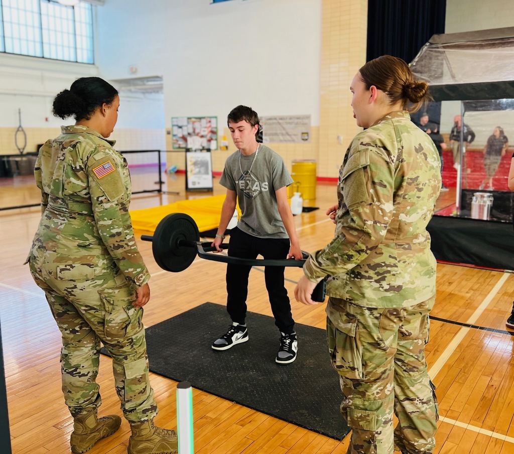 Boy lifting weights near 2 army guards